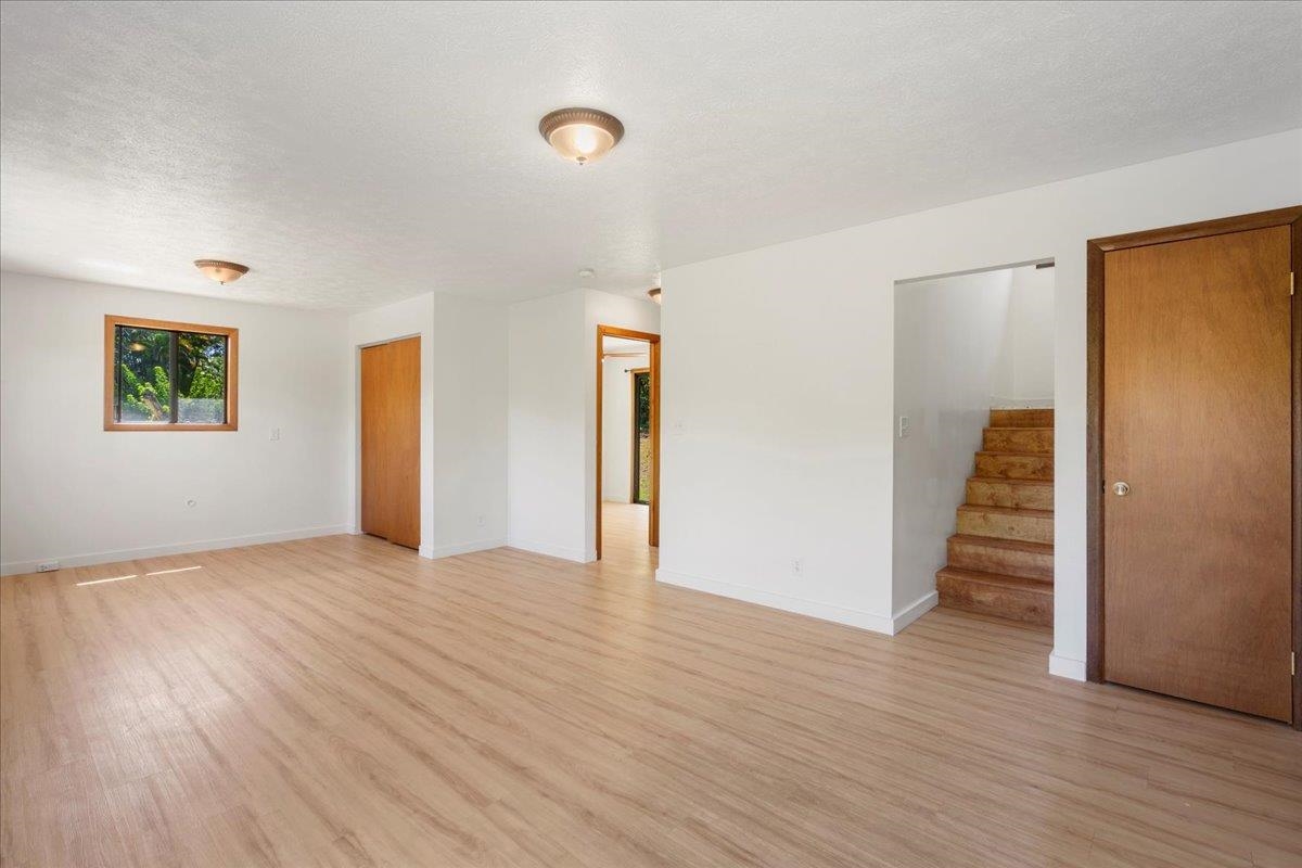 2130 Kauhikoa Road, Unit A Haiku, HI 96708 - Photo 25 of 43 an empty room with wooden floor and closet
