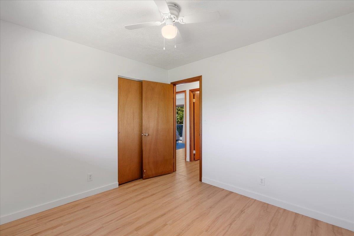 2130 Kauhikoa Road, Unit A Haiku, HI 96708 - Photo 26 of 43 an empty room with wooden floor and door