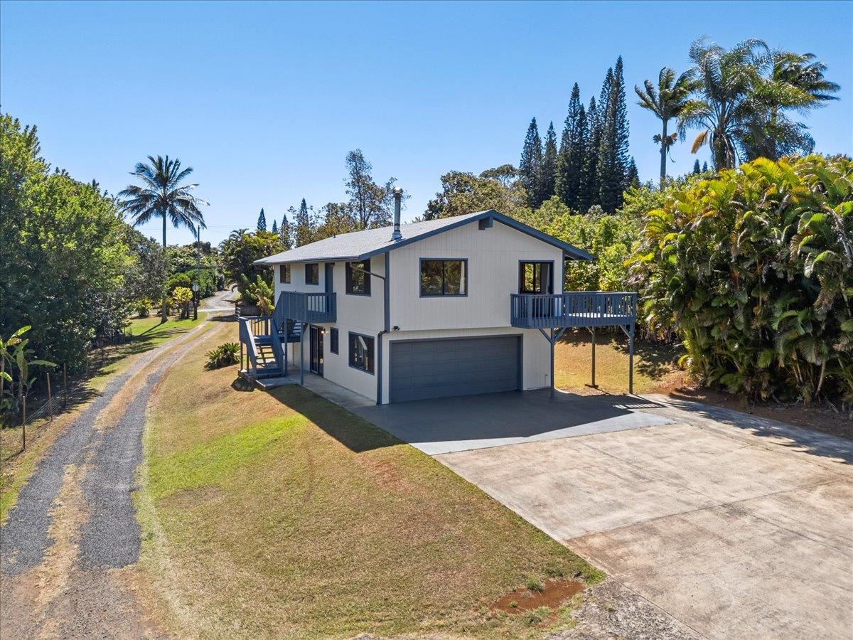 2130 Kauhikoa Road, Unit A Haiku, HI 96708 - Photo 34 of 43 a view of a house with backyard and sitting area
