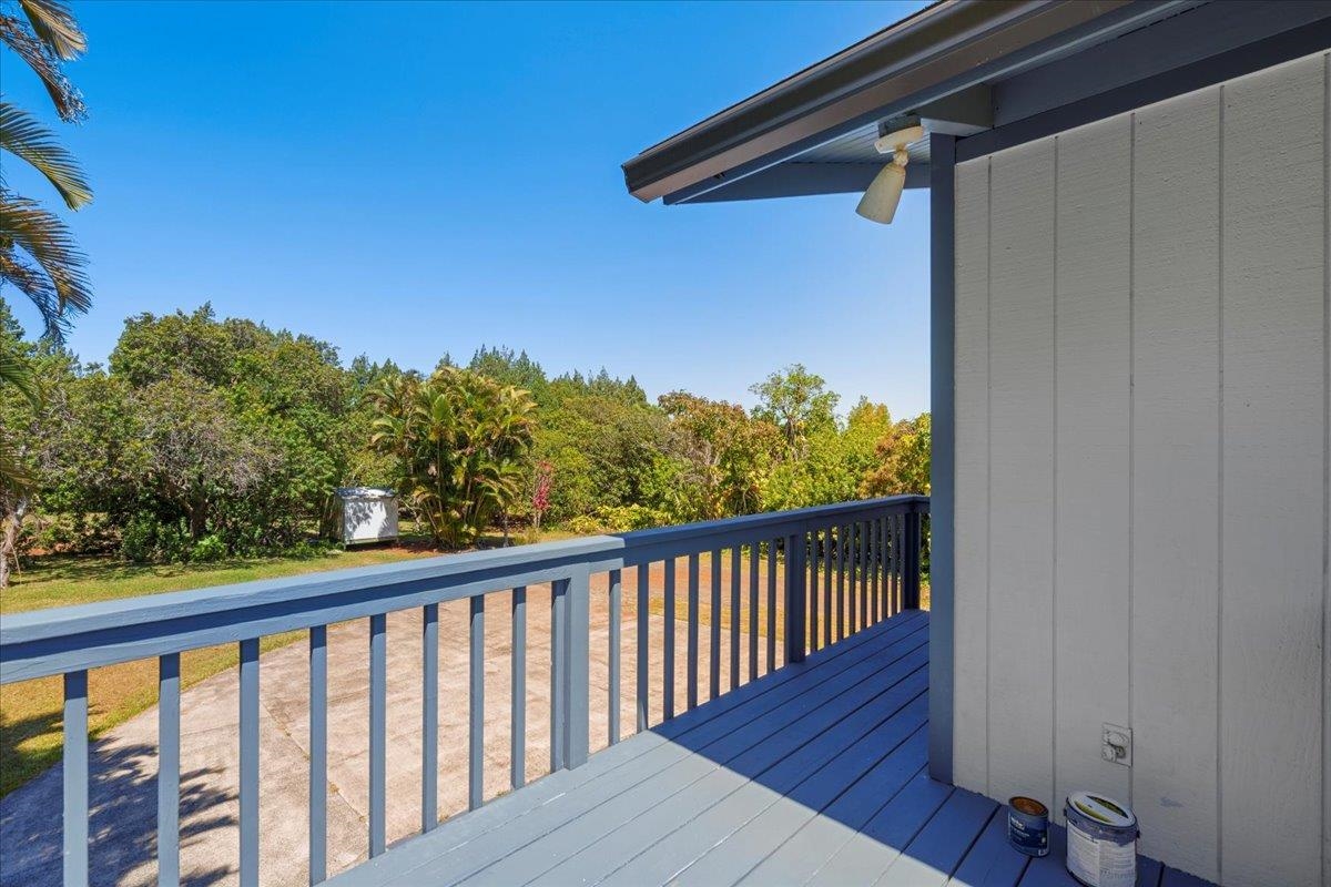 2130 Kauhikoa Road, Unit A Haiku, HI 96708 - Photo 39 of 43 a view of a balcony with wooden floor