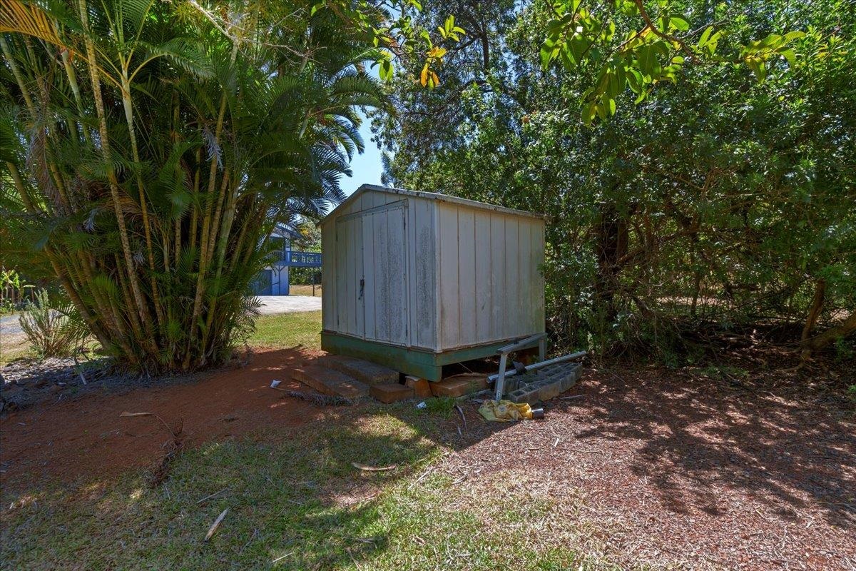 2130 Kauhikoa Road, Unit A Haiku, HI 96708 - Photo 43 of 43 a backyard of a house with table and chairs