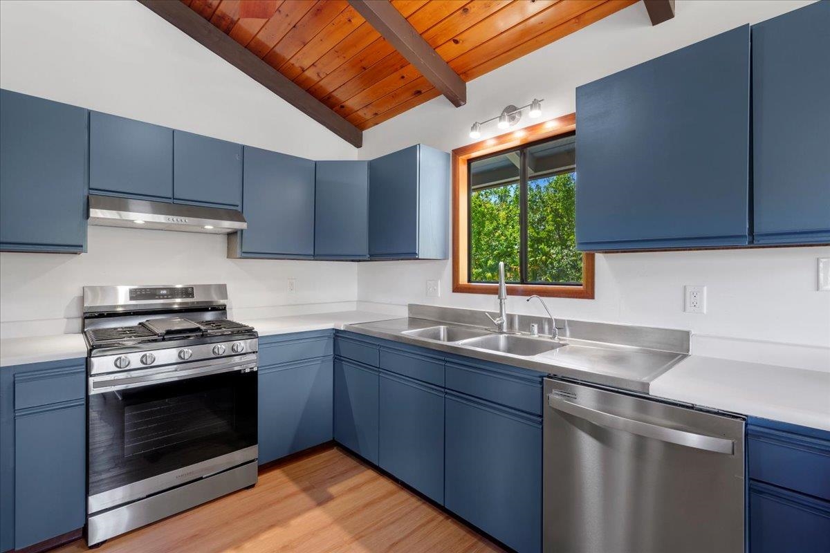 2130 Kauhikoa Road, Unit A Haiku, HI 96708 - Photo 6 of 43 a kitchen with a sink stove top oven and cabinets