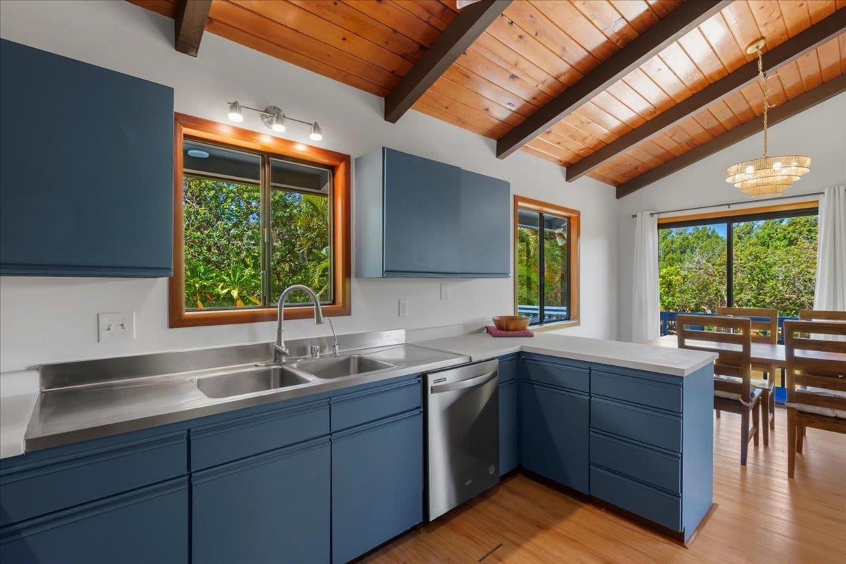 2130 Kauhikoa Road, Unit A Haiku, HI 96708 - Photo 7 of 43 a kitchen with a sink window and cabinets