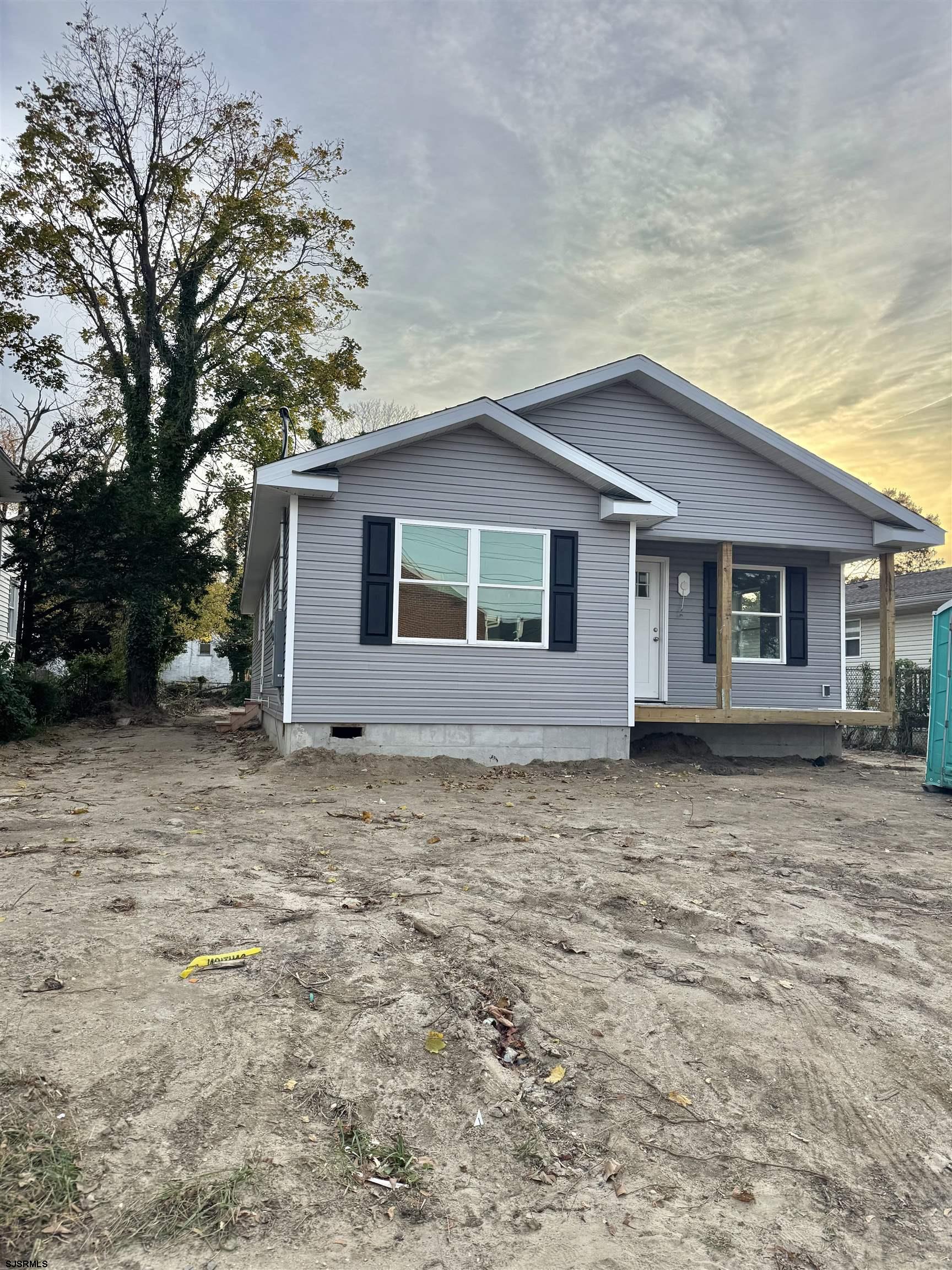 325 West Wright Street Pleasantville, NJ 08232 - Photo 1 of 2 a house with trees in the background