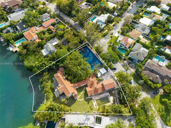 an aerial view of a house with swimming pool