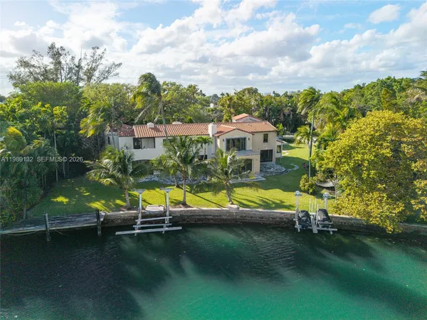 an aerial view of a house with a swimming pool