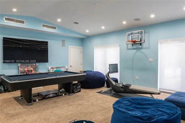 a room with furniture and a flat screen tv
