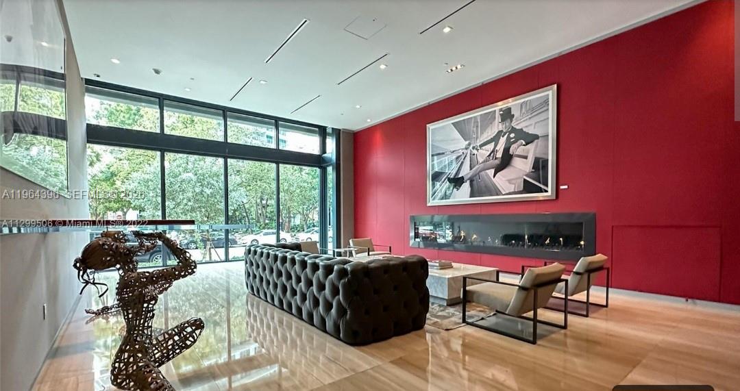 1080 Brickell Avenue, Unit 2804 Miami, FL 33131 - Photo 35 of 35 a living room with furniture and a large window