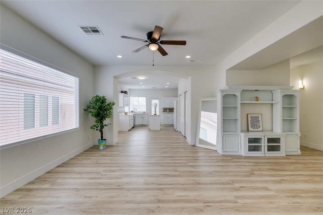 10959 Pumpkin Ridge Avenue Las Vegas, NV 89135 - Photo 50 of 51 Open floorplan living area flows into a well-appointed kitchen, ideal for effortless entertaining.