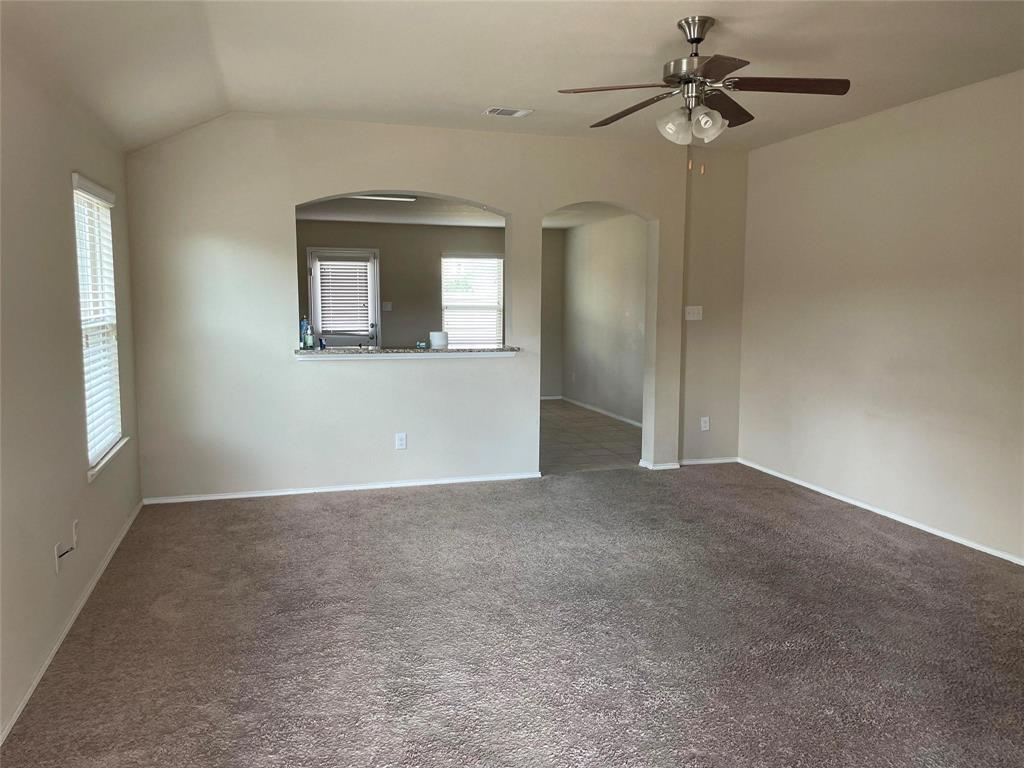 2406 Fall Court Anna, TX 75409 - Photo 5 of 9 a view of a livingroom with a ceiling fan and window