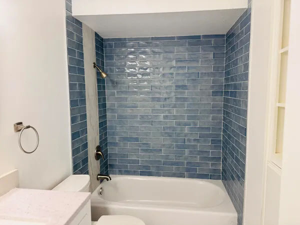a bathroom with a bathtub and a shower
