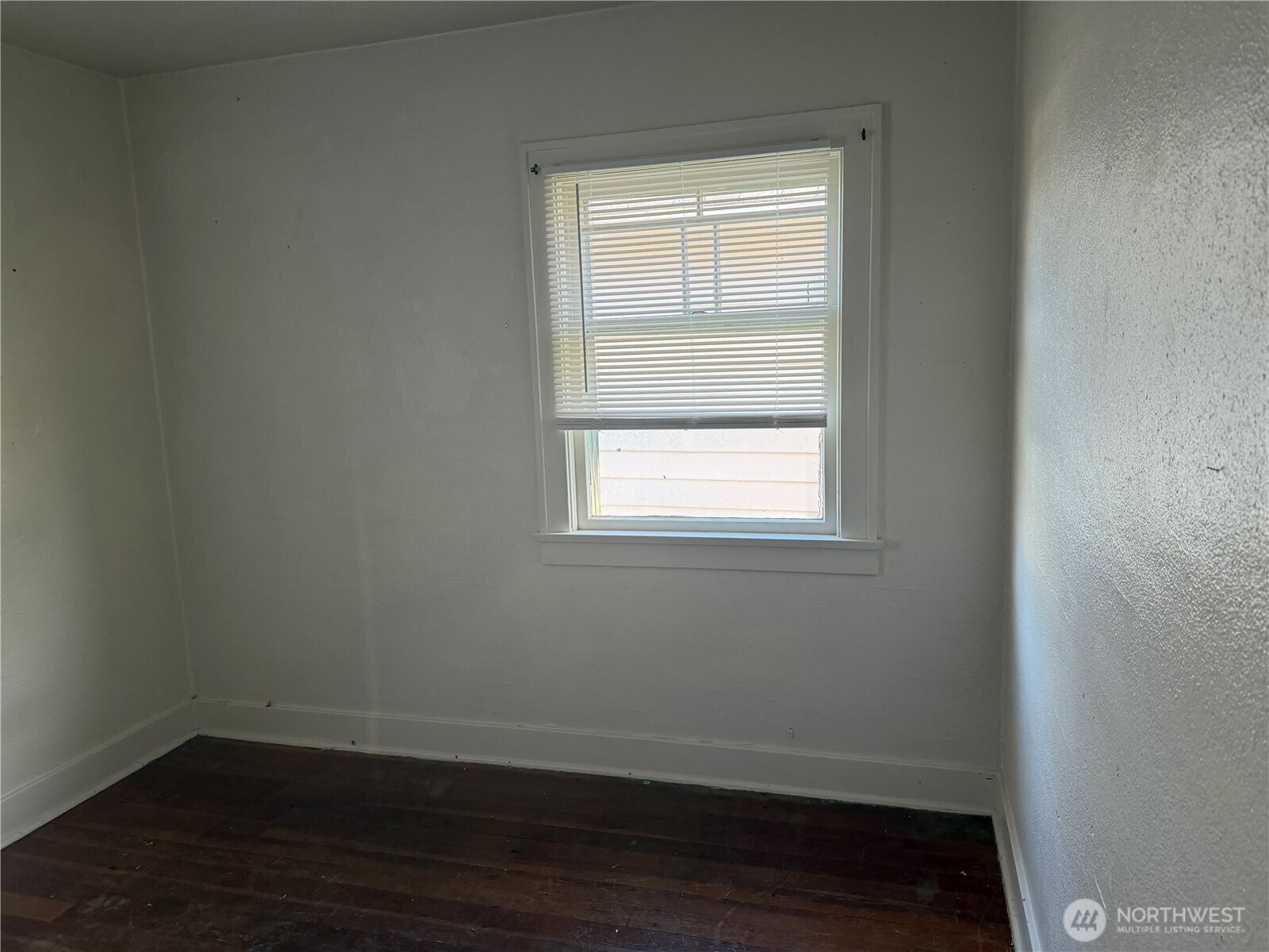 3101 Sumner Avenue Hoquiam, WA 98550 - Photo 8 of 21 a view of a small space with wooden floor and a window