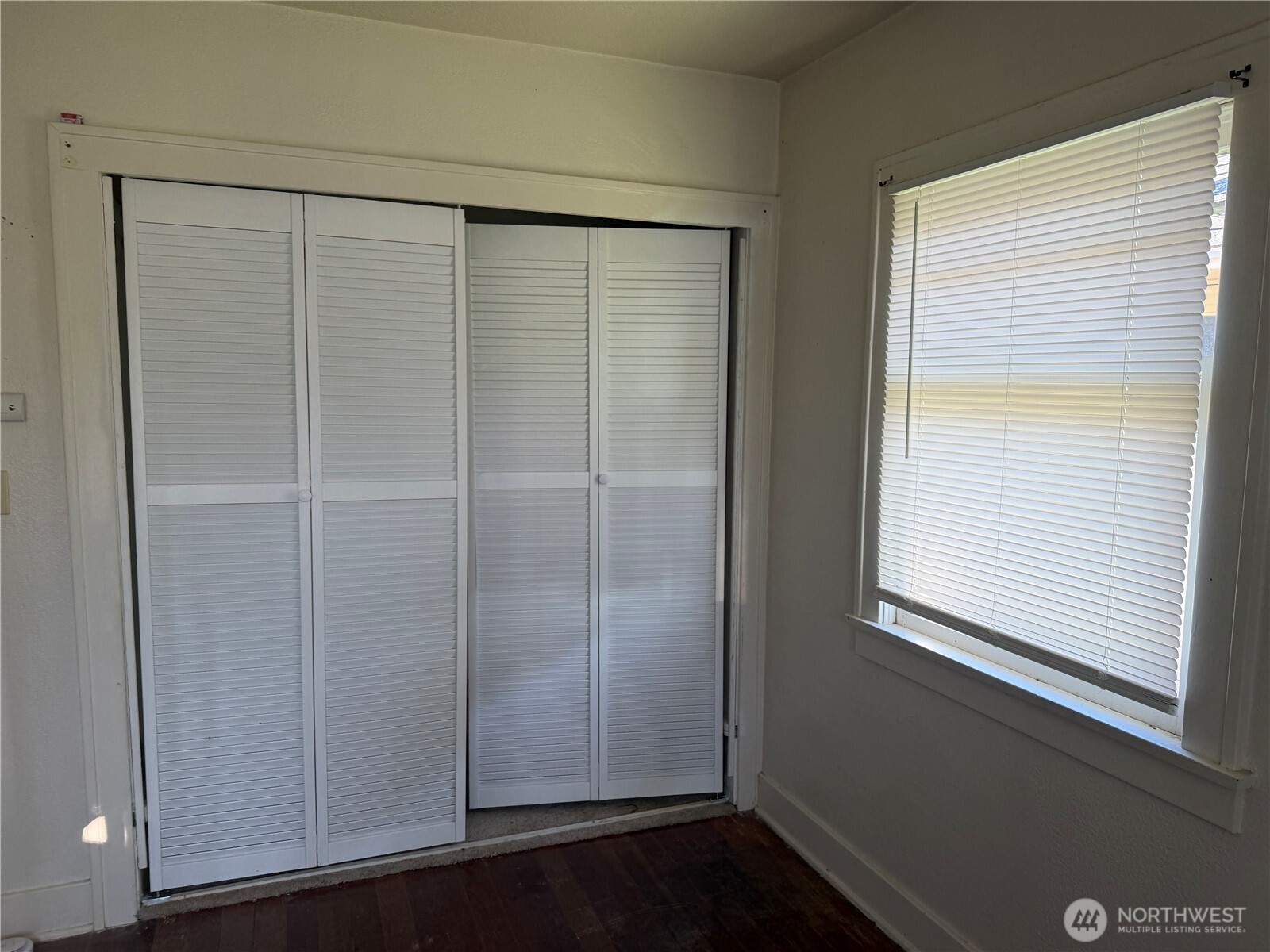 3101 Sumner Avenue Hoquiam, WA 98550 - Photo 9 of 21 a view of an empty room with wooden floor and closet