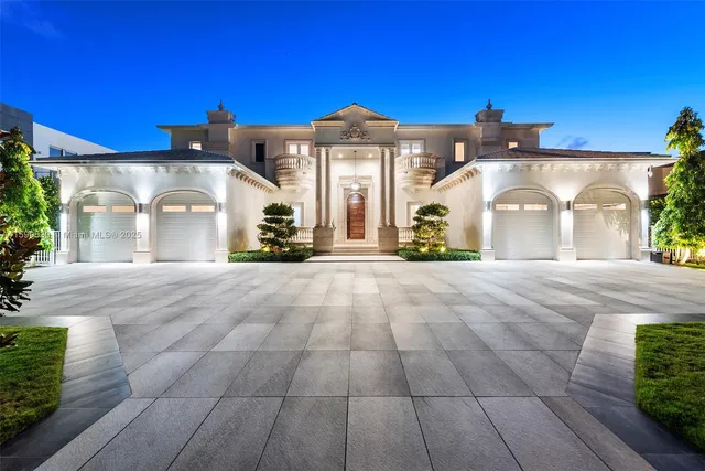 a view of a house with swimming pool and sitting area