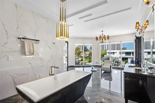 an aerial view of residential houses with outdoor space and swimming pool