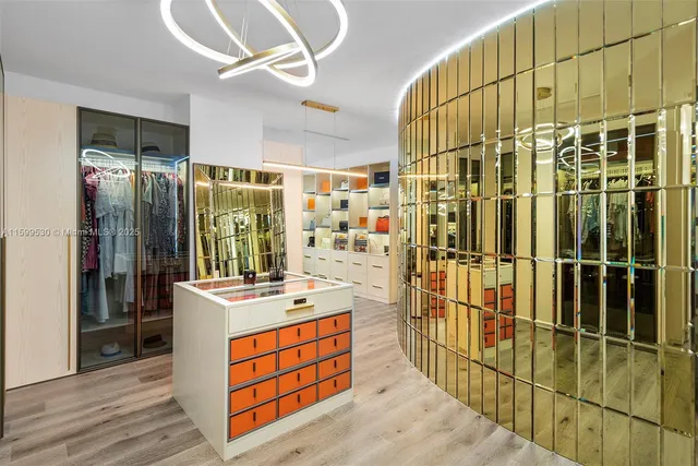 an aerial view of residential houses with outdoor space and lake view