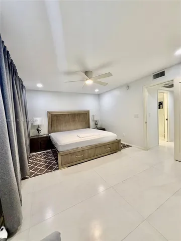 a bedroom with a bed and walk in closet