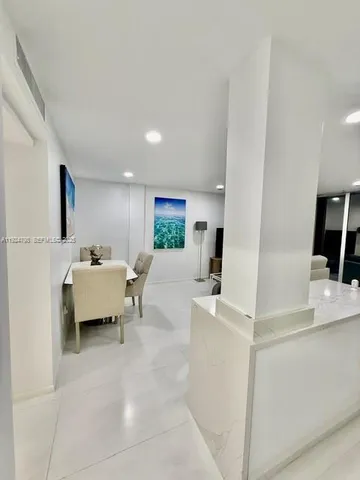 a bathroom with a shower and a glass shower