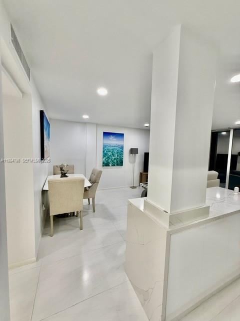 1100 Alton Road, Unit 4D Miami Beach, FL 33139 - Photo 24 of 39 a living room with furniture and a table