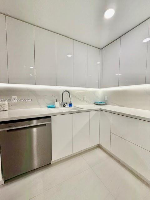 1100 Alton Road, Unit 4D Miami Beach, FL 33139 - Photo 3 of 39 a kitchen with cabinets appliances and a sink