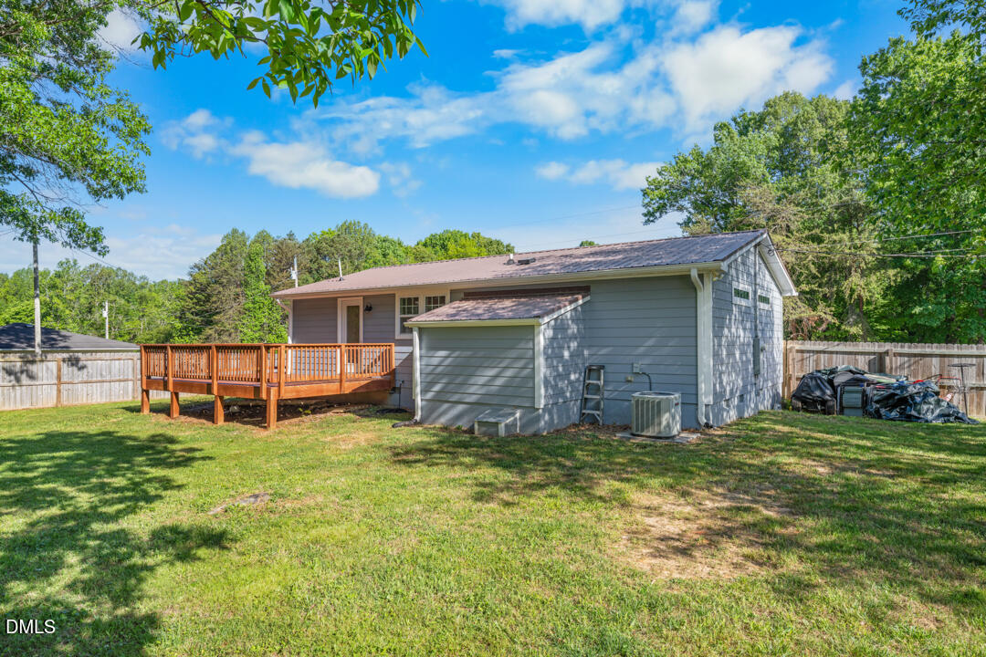 454 Cedar Creek Road Timberlake, NC 27583 - Photo 29 of 39 a view of a house with a yard