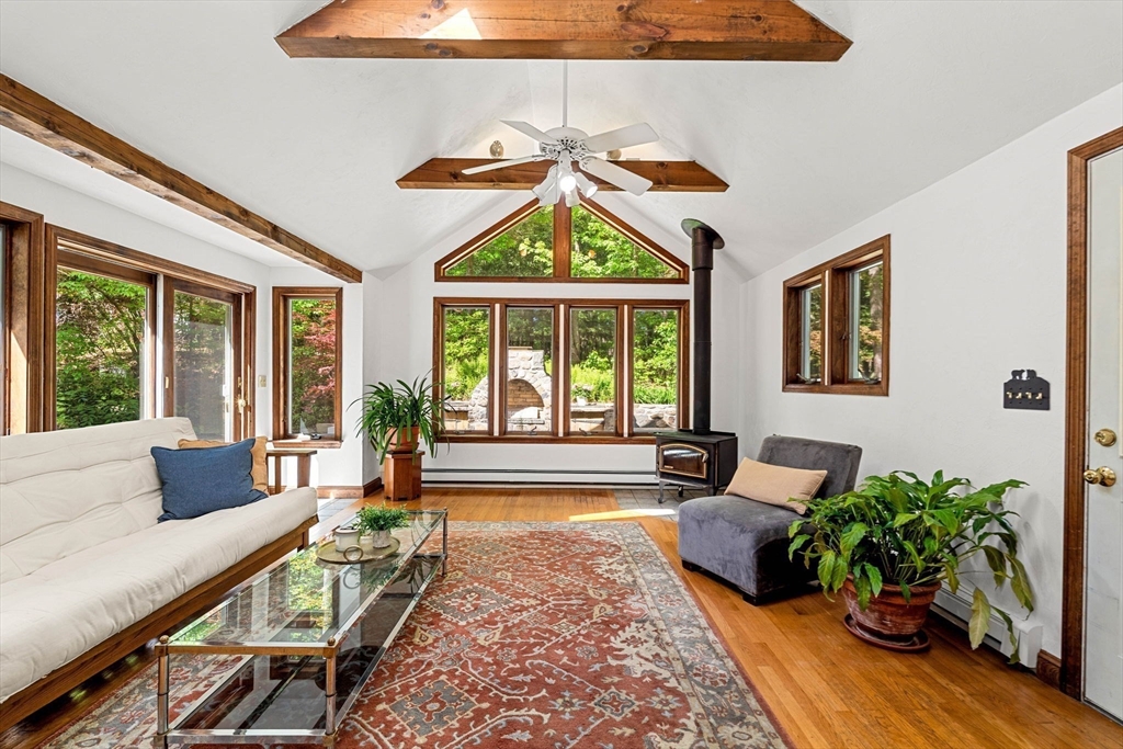 371 Longley Road Groton, MA 01450 - Photo 7 of 33 a living room with furniture and a large window