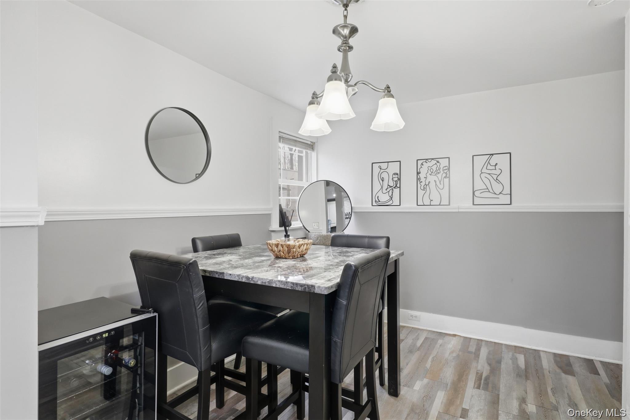121 Little Britain Road Newburgh, NY 12550 - Photo 9 of 15 a view of a dining room with furniture wooden floor and a chandelier
