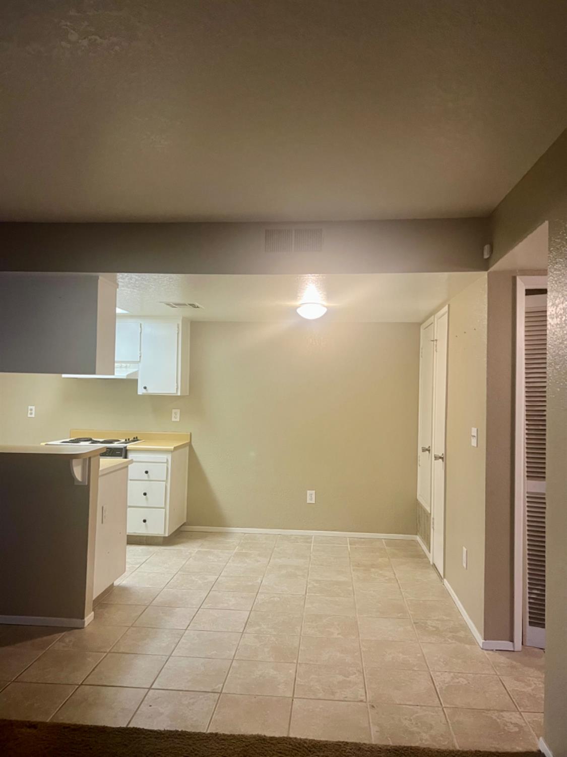 1545 Pyrenees Avenue, Unit 30 Stockton, CA 95210 - Photo 15 of 29 a view of a kitchen with a sink and dishwasher a stove top oven with wooden floor