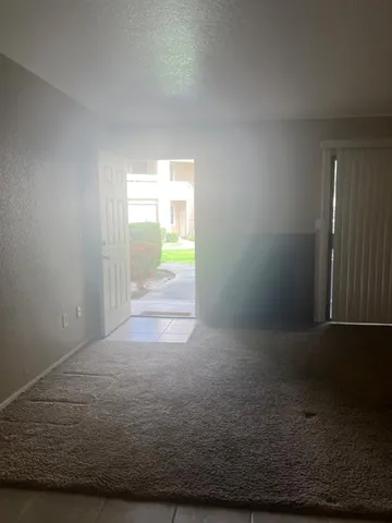 a view of balcony with a yard