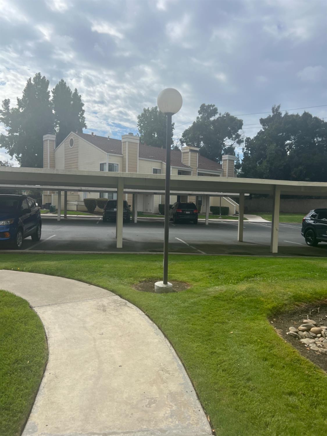 1545 Pyrenees Avenue, Unit 30 Stockton, CA 95210 - Photo 26 of 29 a view of a swimming pool with a garden
