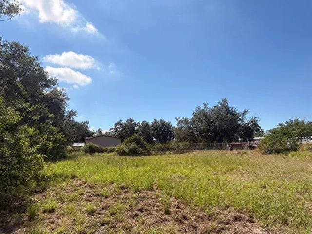 a view of a lake view with houses in back