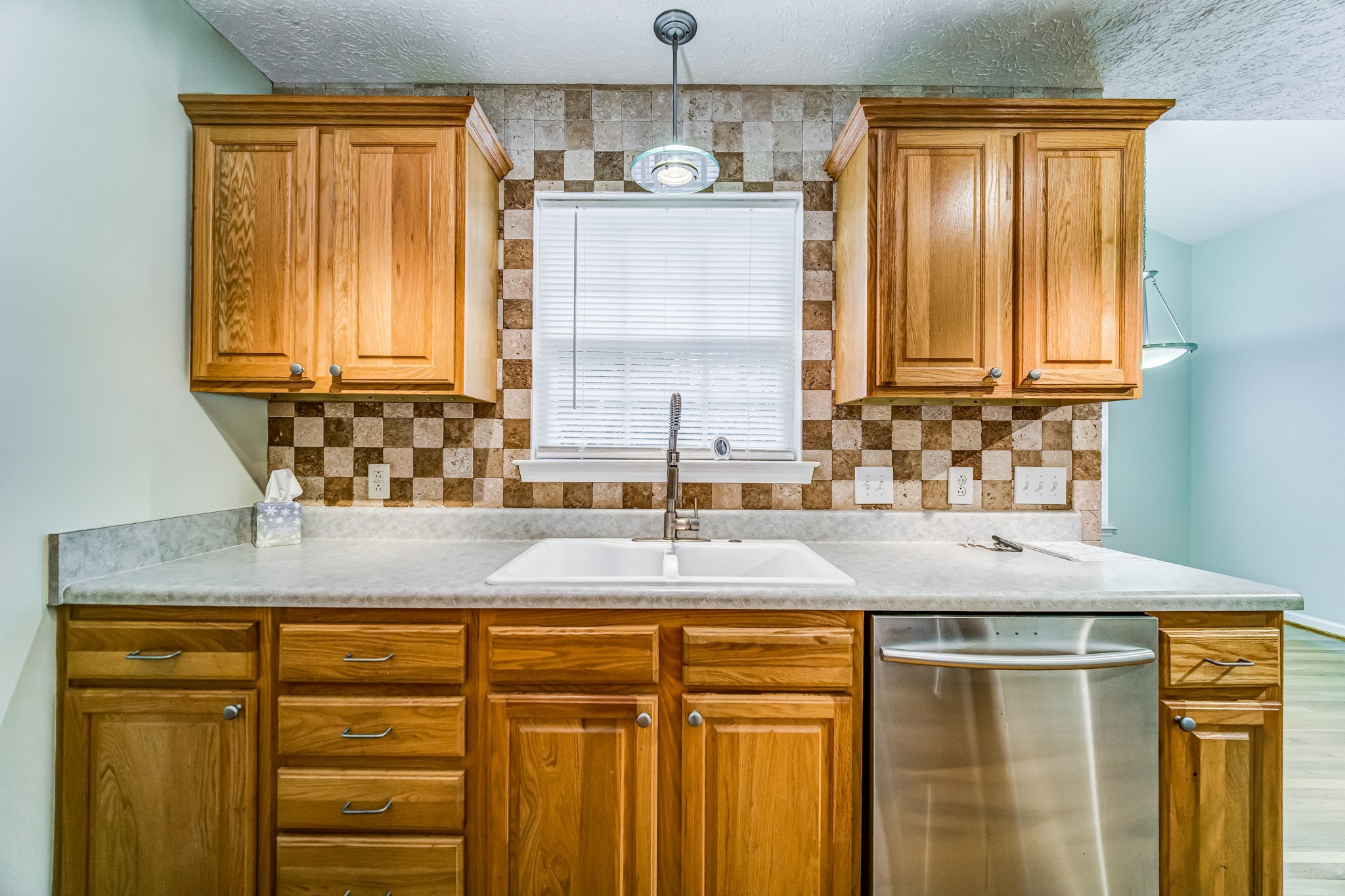 7583 Cherokee Hills Road Fairview, TN 37062 - Photo 15 of 62 a kitchen with granite countertop a sink and a window