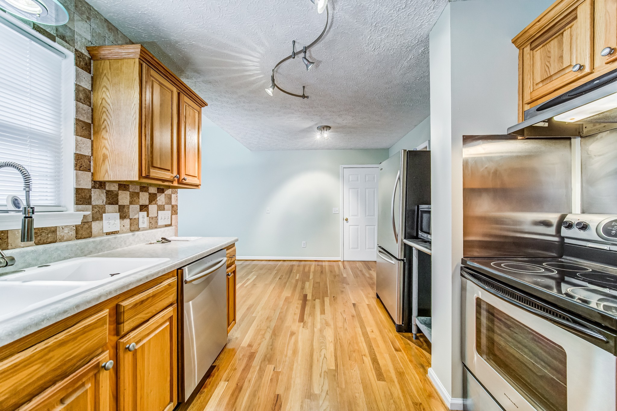 7583 Cherokee Hills Road Fairview, TN 37062 - Photo 16 of 62 a kitchen with a sink stove and refrigerator