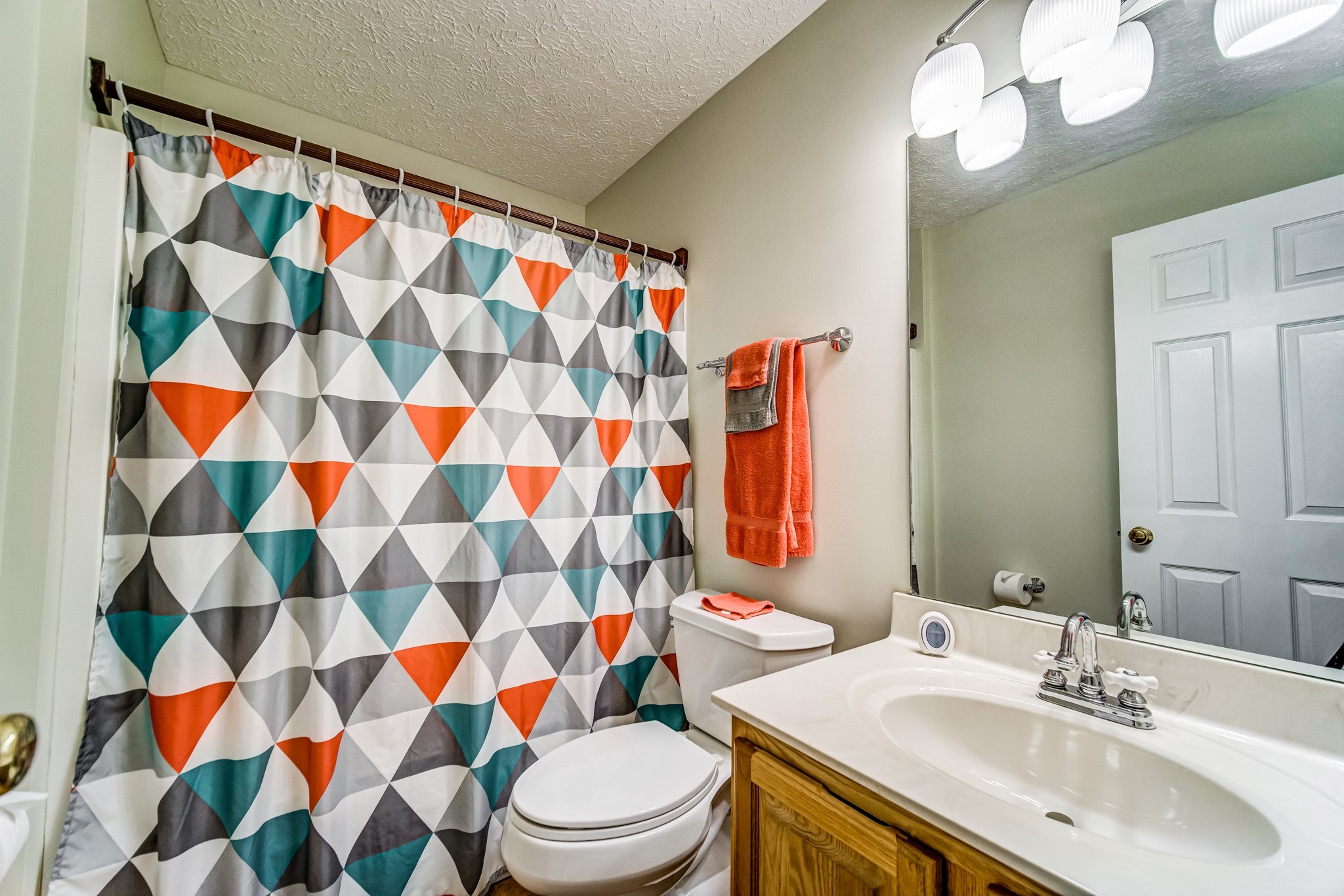 7583 Cherokee Hills Road Fairview, TN 37062 - Photo 20 of 62 a bathroom with a sink toilet and shower