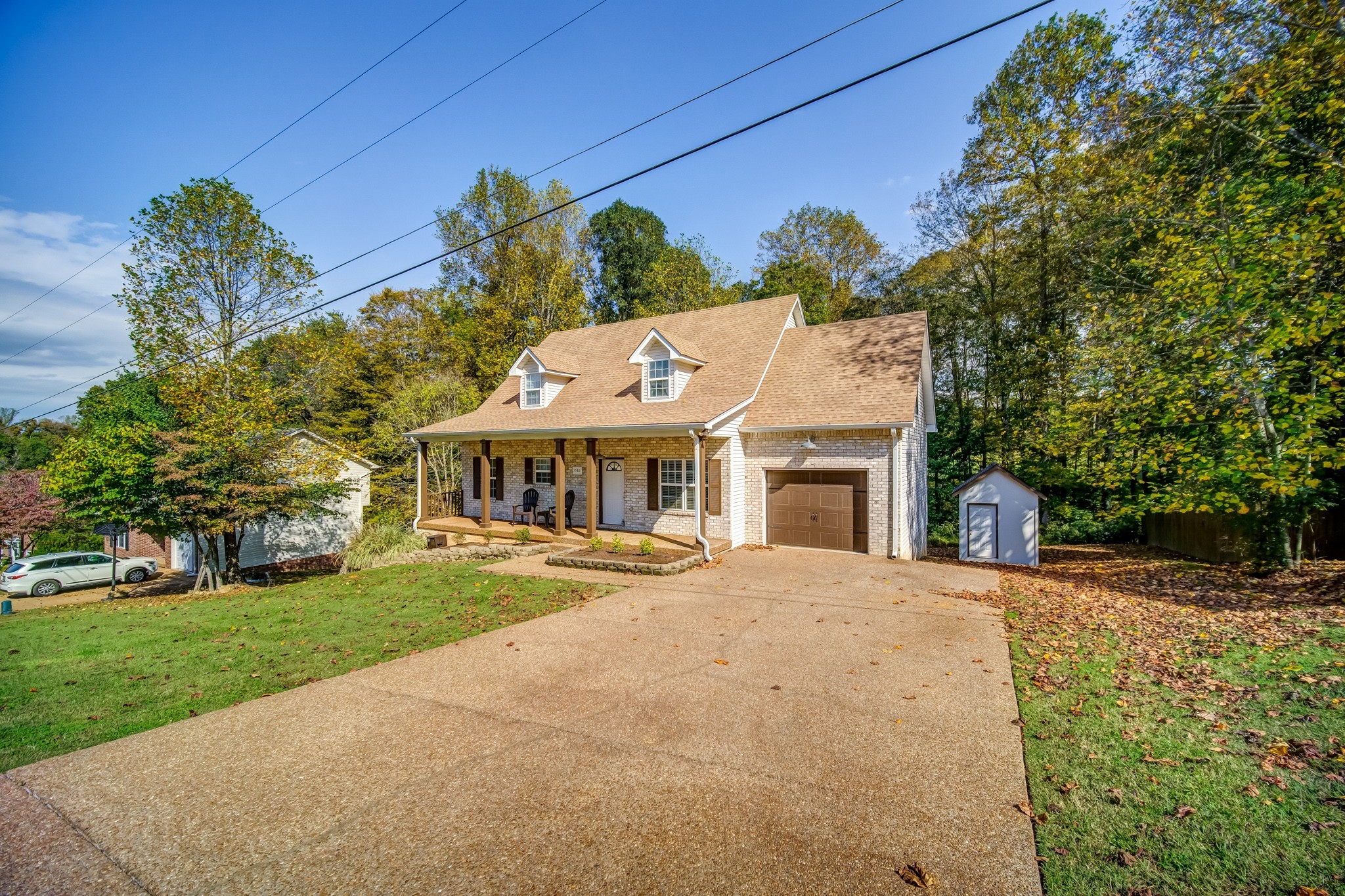 7583 Cherokee Hills Road Fairview, TN 37062 - Photo 3 of 62 a front view of a house with a garden