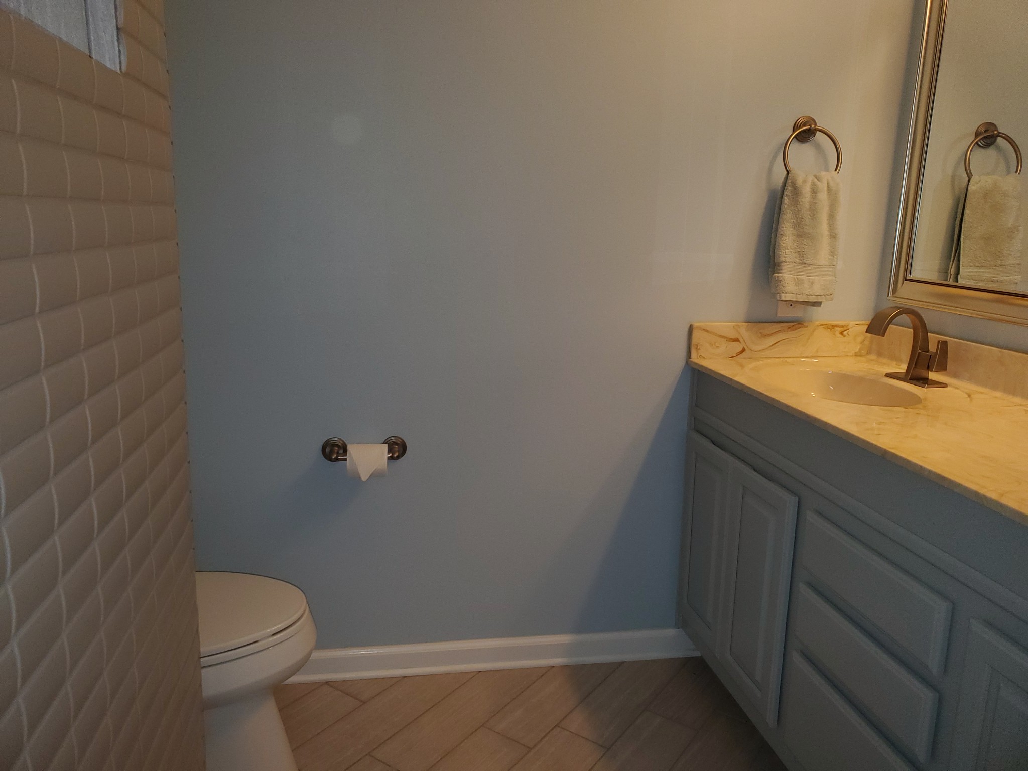 7583 Cherokee Hills Road Fairview, TN 37062 - Photo 46 of 62 a bathroom with a granite countertop sink toilet and a mirror