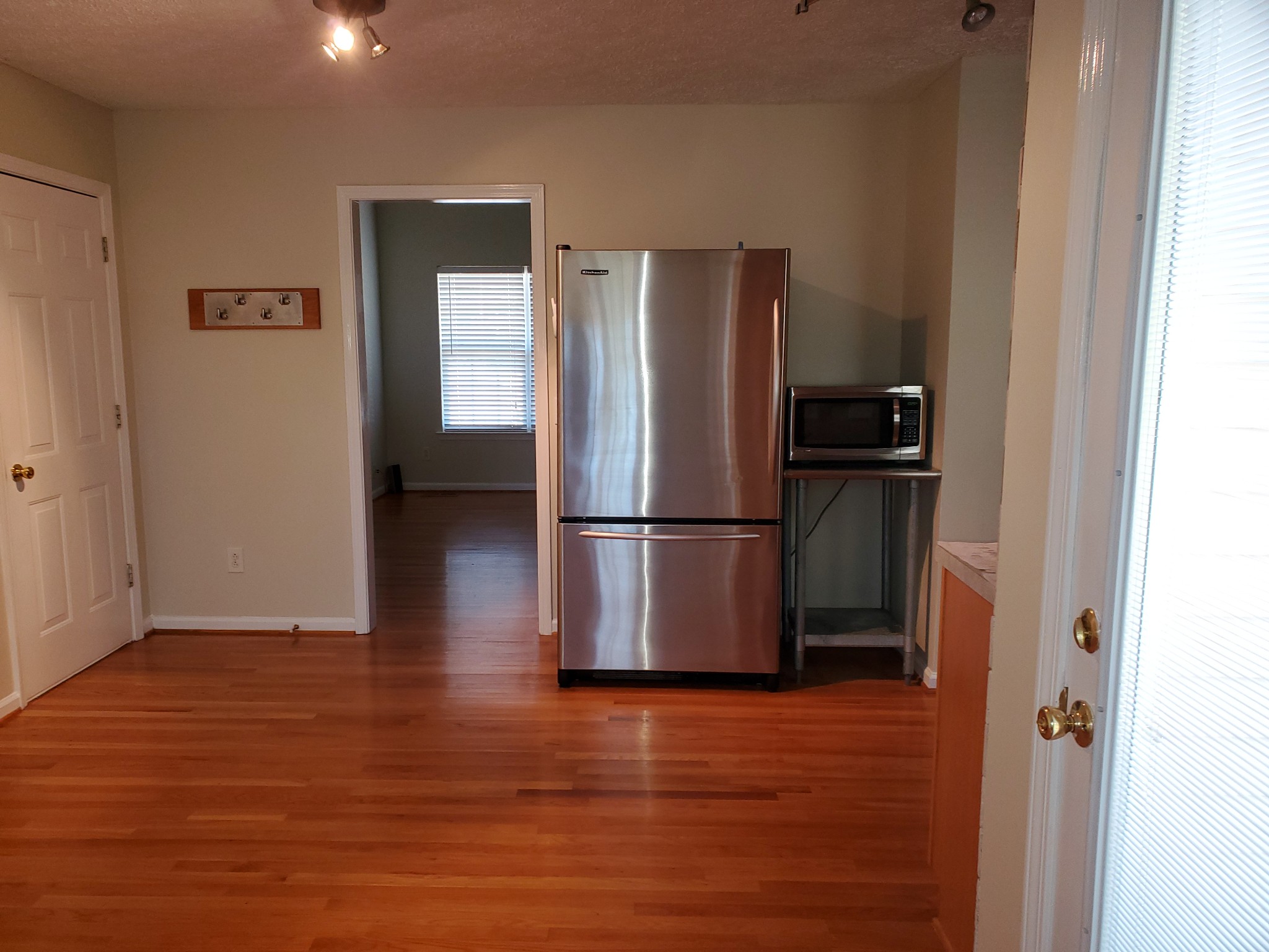 7583 Cherokee Hills Road Fairview, TN 37062 - Photo 52 of 62 a view of a refrigerator in kitchen and wooden floor