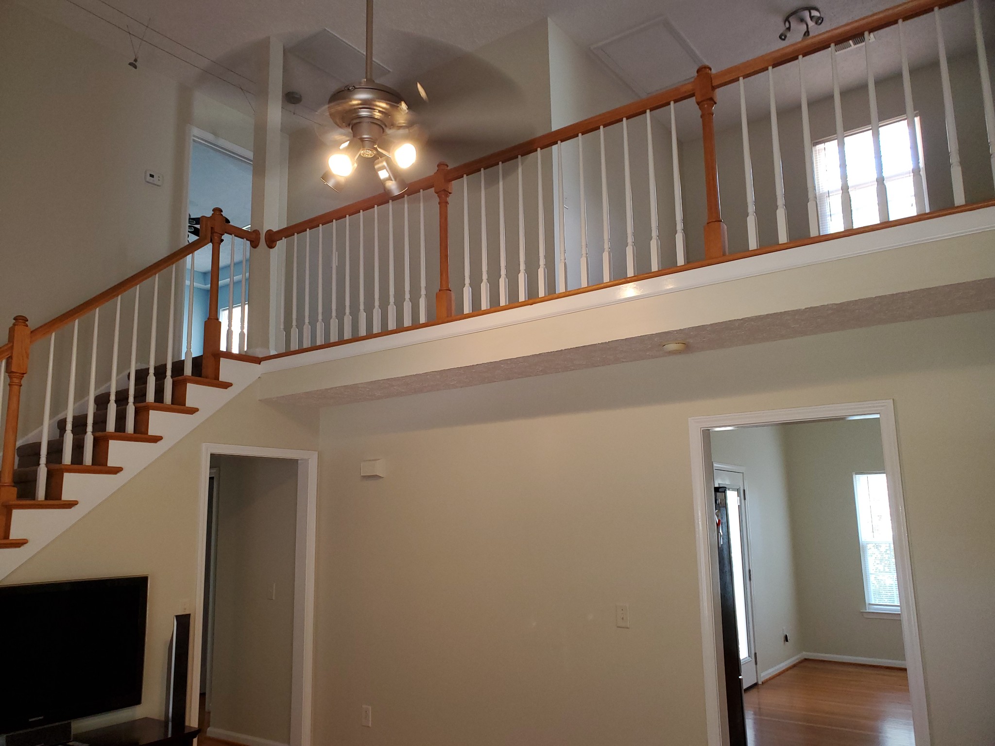 7583 Cherokee Hills Road Fairview, TN 37062 - Photo 54 of 62 a view of staircase with railing and a chandelier