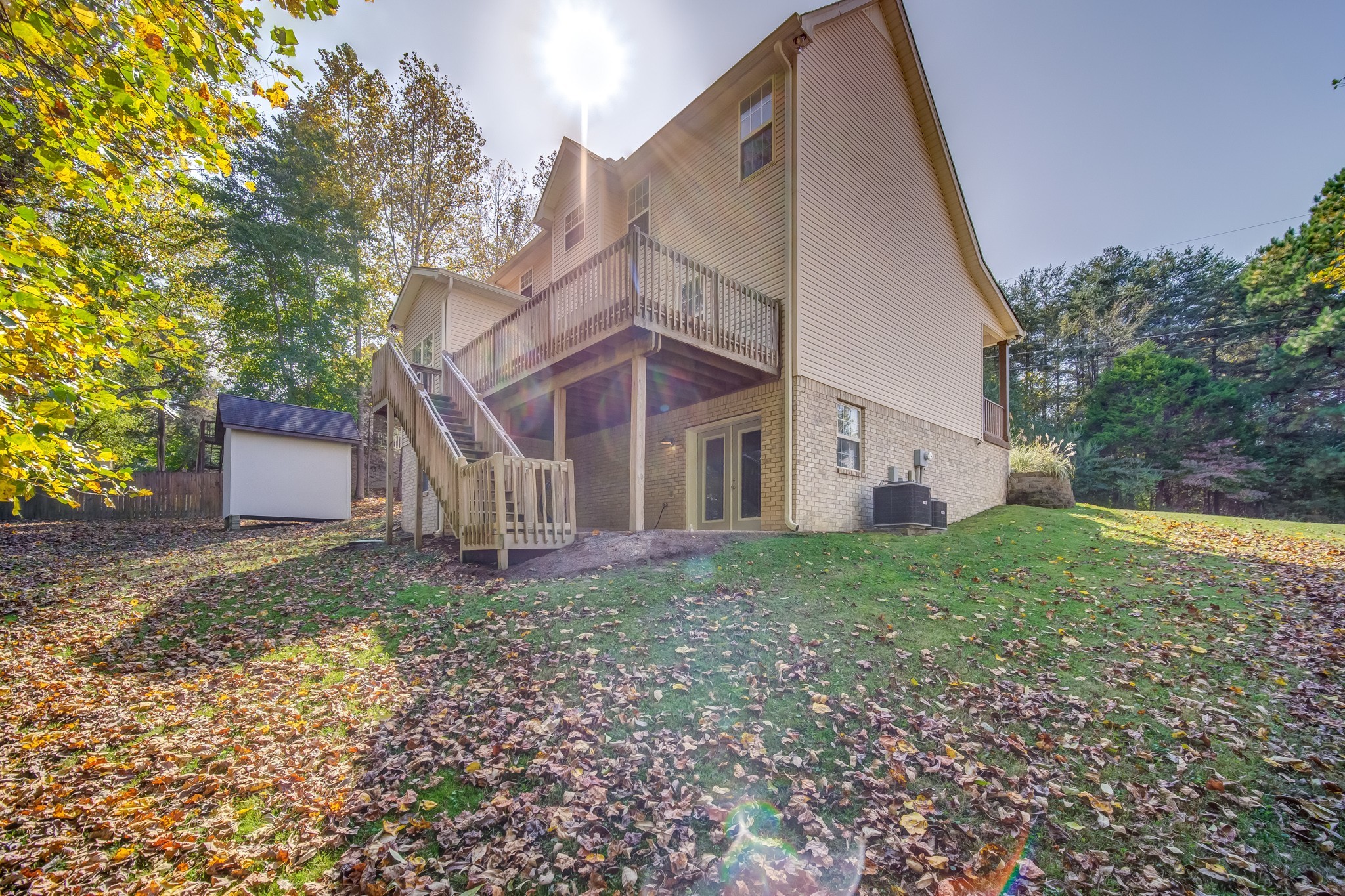 7583 Cherokee Hills Road Fairview, TN 37062 - Photo 59 of 62 a view of a house with a yard and a large tree