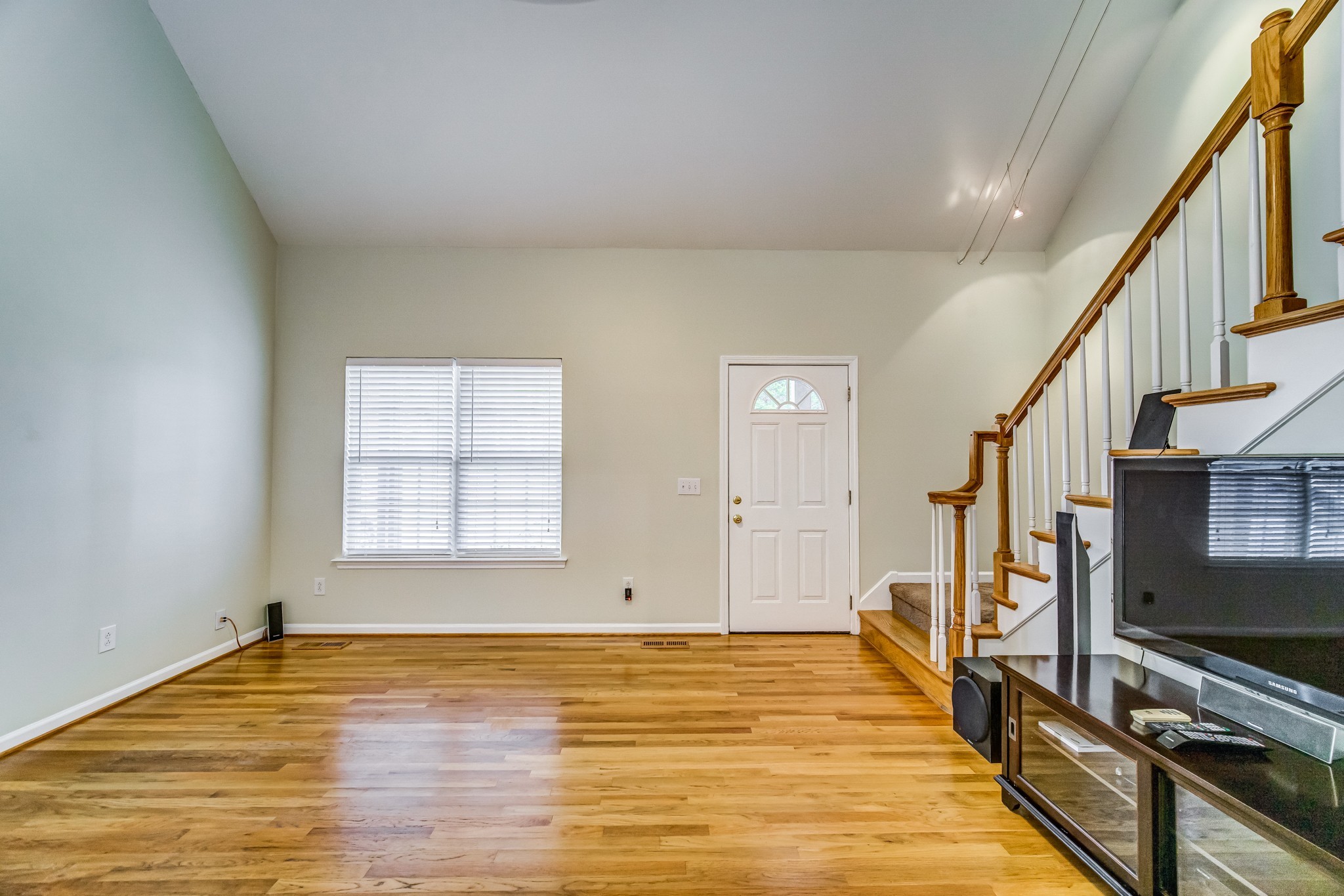 7583 Cherokee Hills Road Fairview, TN 37062 - Photo 10 of 62 a view of an empty room with wooden floor and a window