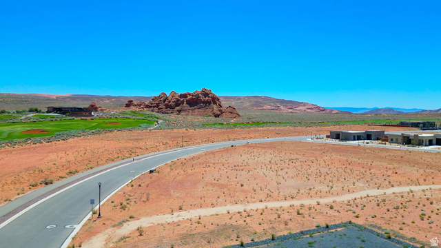 3306 South Endless Trail, Unit 33 Hurricane, UT 84737 - Photo 22 of 27 Expansive desert landscape featuring red rock formations and a distant golf course