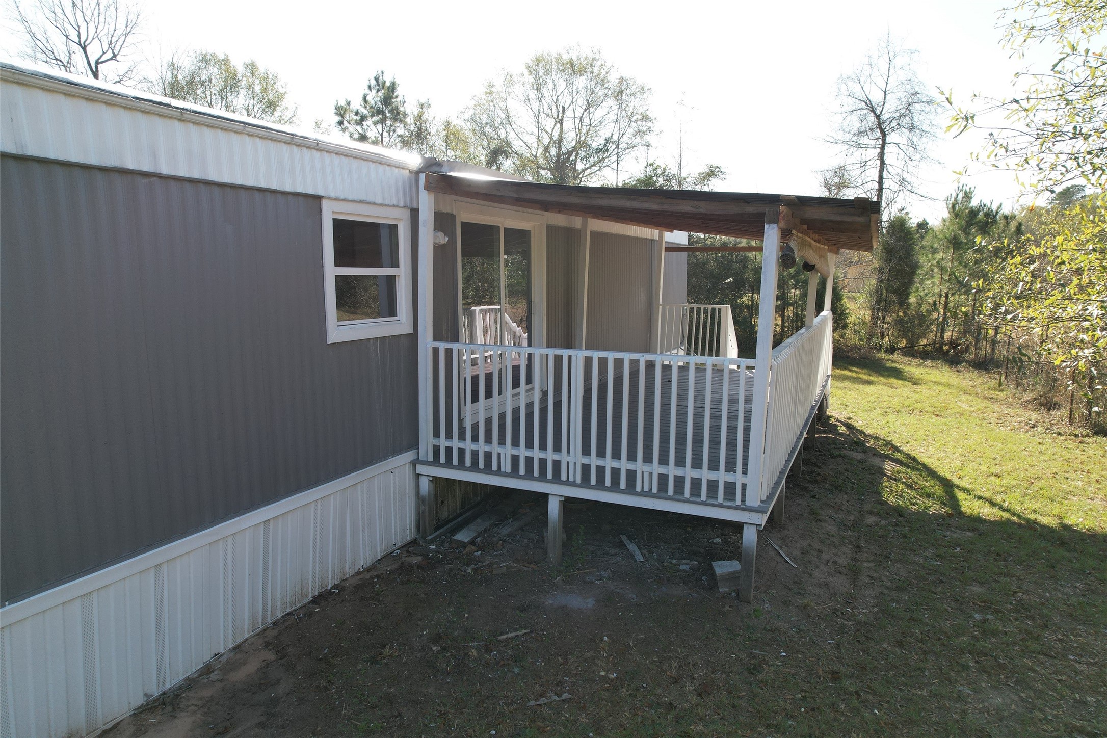 16428 Jireh Road Conroe, TX 77306 - Photo 20 of 25 a view of a deck with a wooden floor and fence