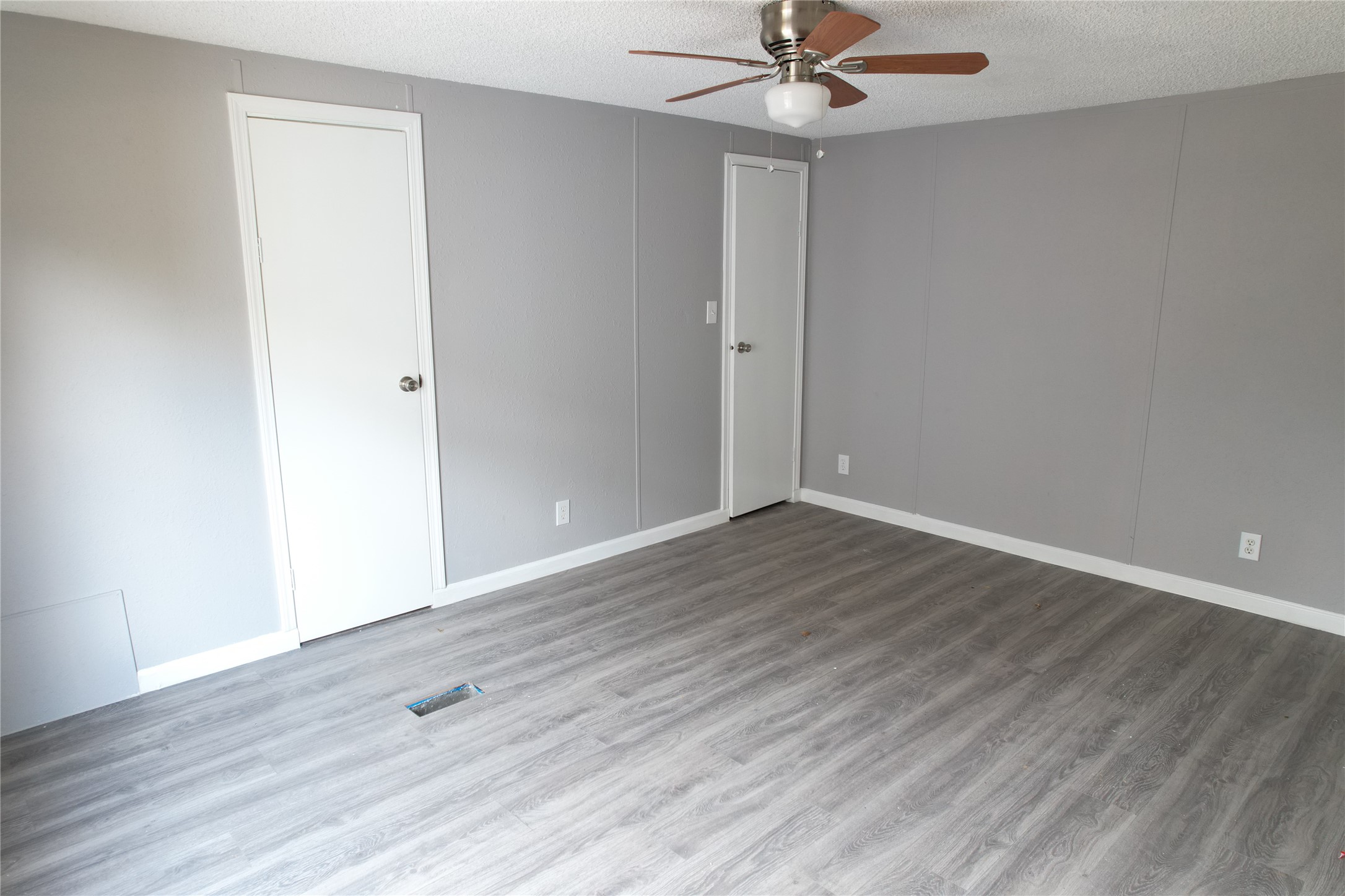 16428 Jireh Road Conroe, TX 77306 - Photo 4 of 25 a view of an empty room with wooden floor
