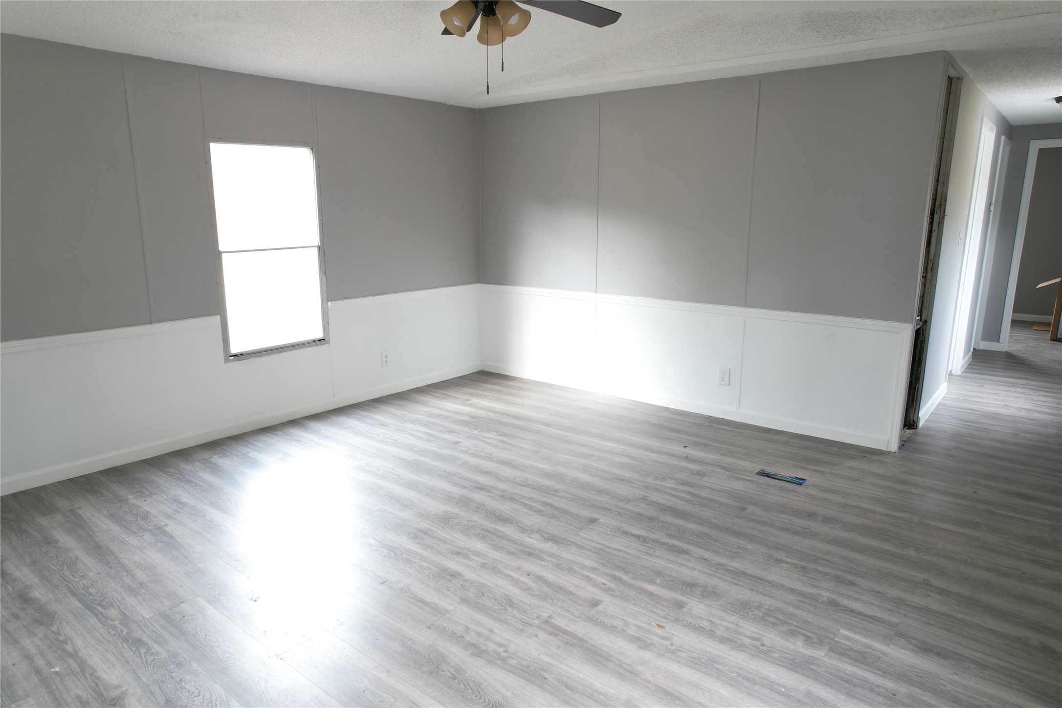16428 Jireh Road Conroe, TX 77306 - Photo 6 of 25 an empty room with wooden floor and windows