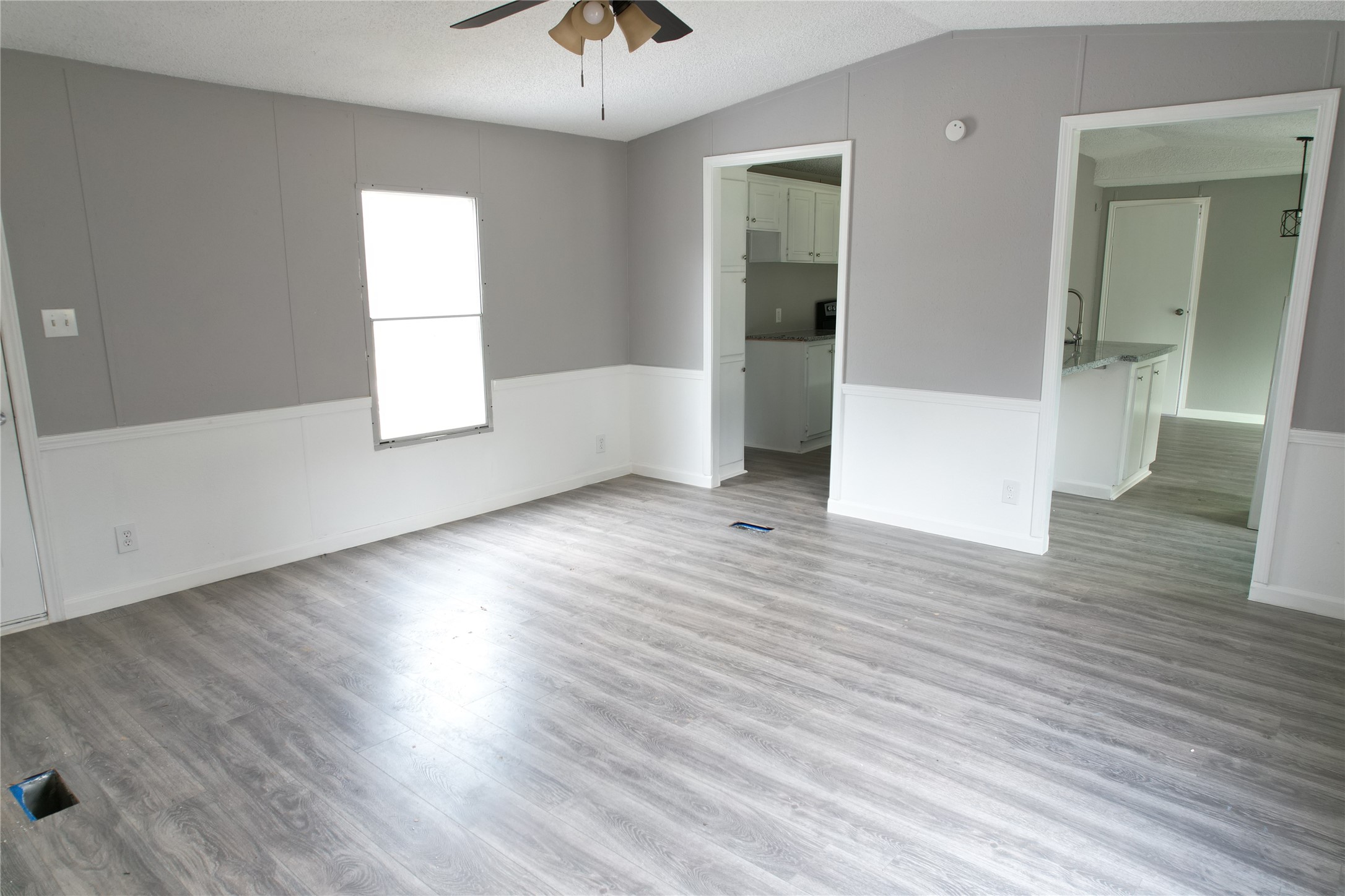 16428 Jireh Road Conroe, TX 77306 - Photo 7 of 25 an empty room with wooden floor and windows