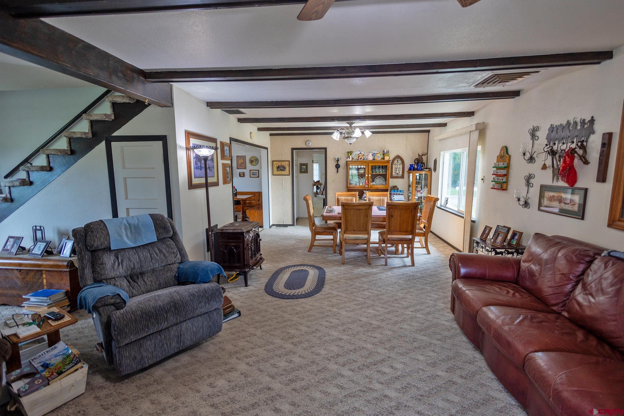 7531 High Mesa Road Olathe, CO 81425 - Photo 22 of 33 a living room with furniture and a couch