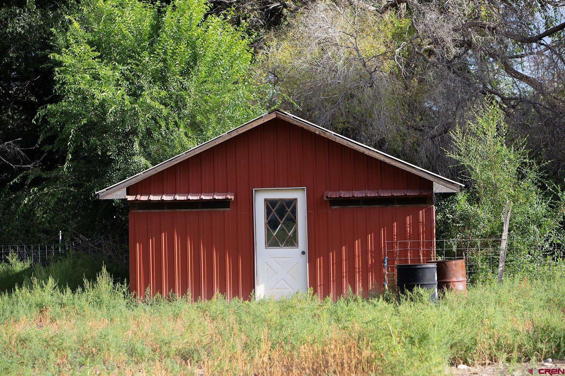 7531 High Mesa Road Olathe, CO 81425 - Photo 30 of 33 a front view of a house with garden