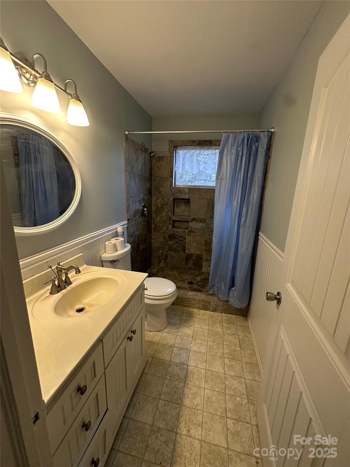 3401 Rilla Hamilton Road Monroe, NC 28110 - Photo 11 of 13 a bathroom with a sink a toilet and shower