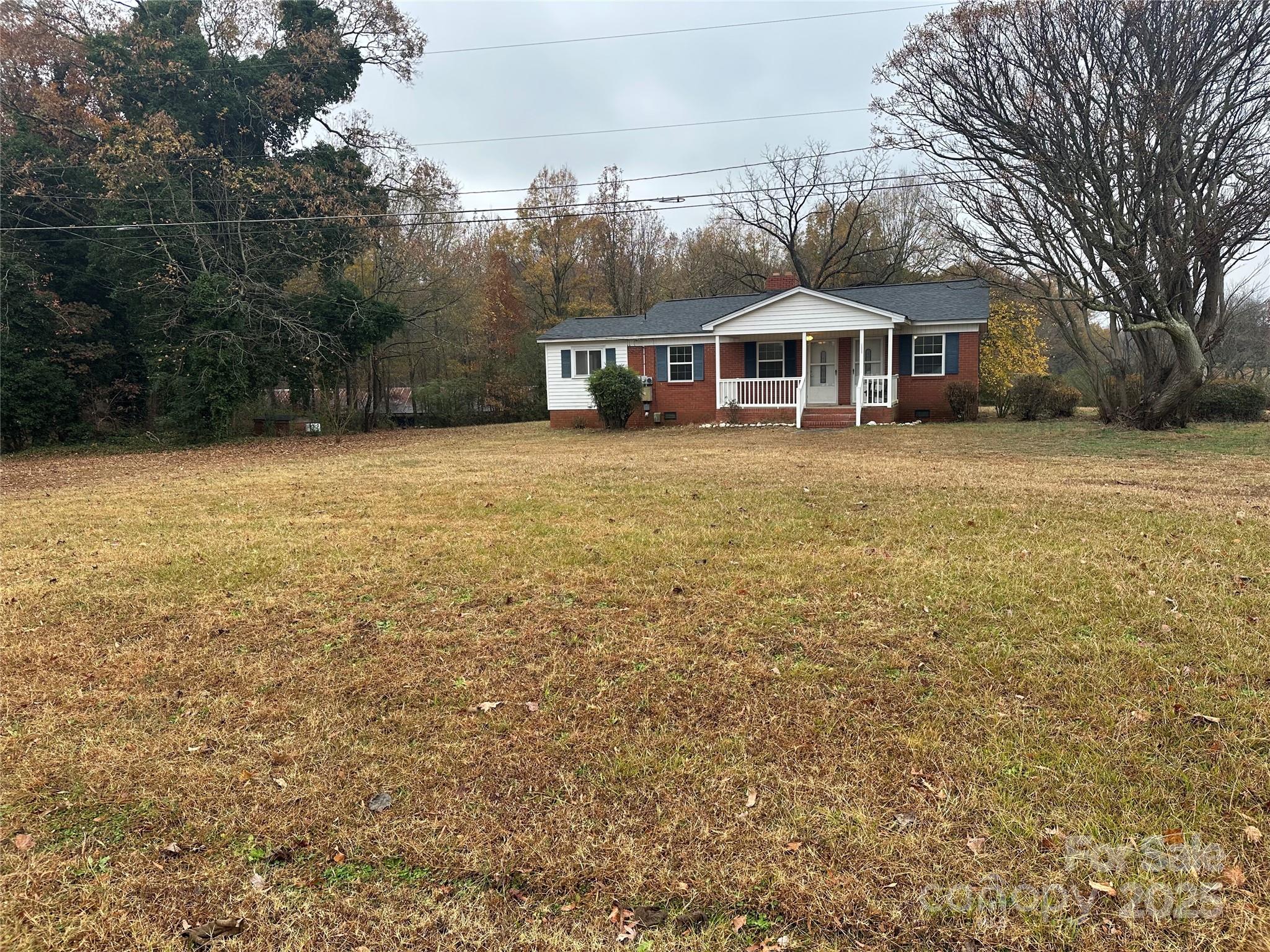 3401 Rilla Hamilton Road Monroe, NC 28110 - Photo 2 of 13 a front view of a house with a garden