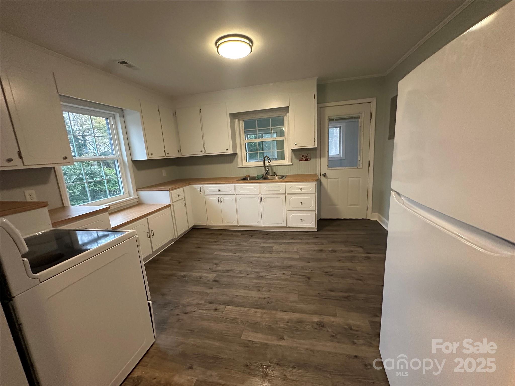 3401 Rilla Hamilton Road Monroe, NC 28110 - Photo 5 of 13 a large white kitchen with a large window